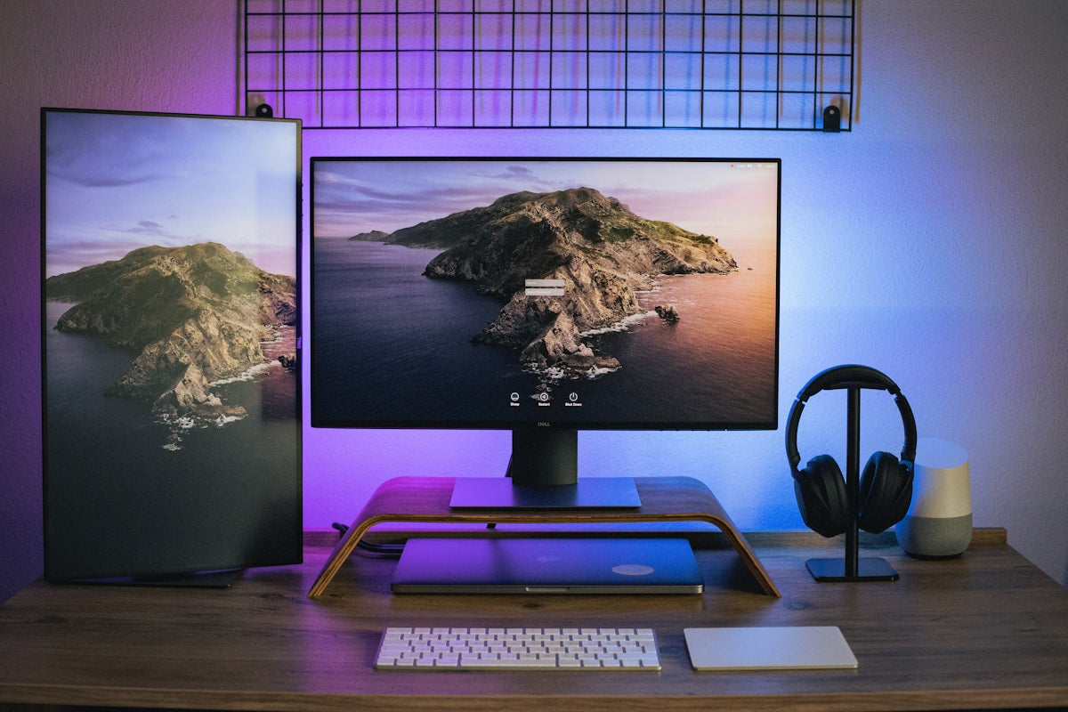 Dell UltraSharp monitor on dark desk